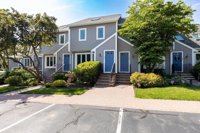 23 Indian Cove Way Unit 23, Easton, MA 02375 - townhome / multi-family property with entry steps, uncovered parking, and a front lawn