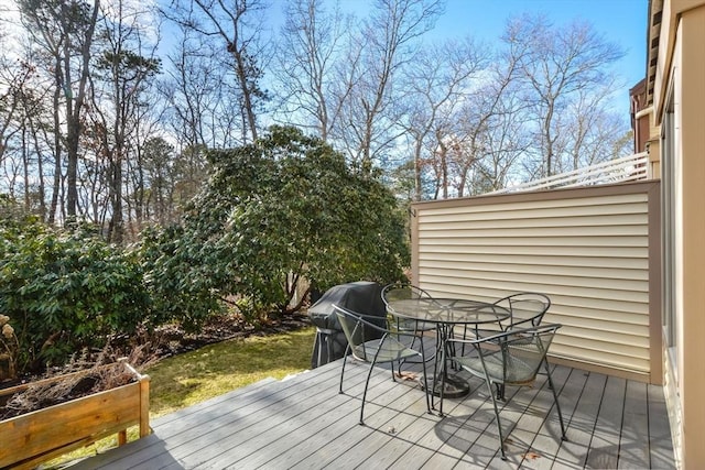 wooden deck with grilling area