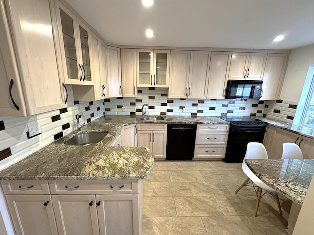 59-R Union St Unit 59-R, Boston, MA 02135 - kitchen featuring black appliances, a sink, decorative backsplash, dark stone counters, and recessed lighting
