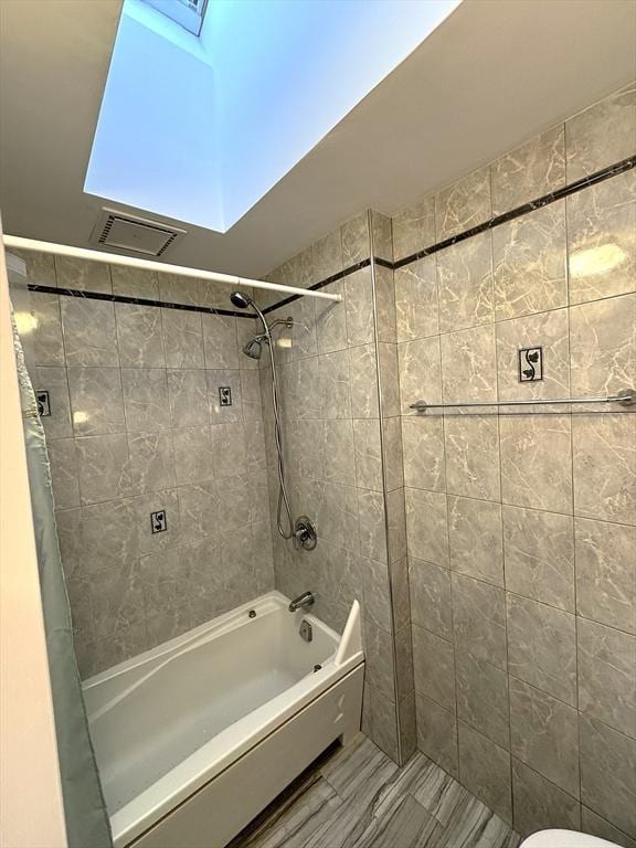 59-R Union St Unit 59-R, Boston, MA 02135 - bathroom featuring shower / tub combo, toilet, and a skylight
