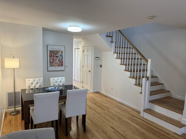 59-R Union St Unit 59-R, Boston, MA 02135 - dining area featuring stairs, wood finished floors, and baseboards