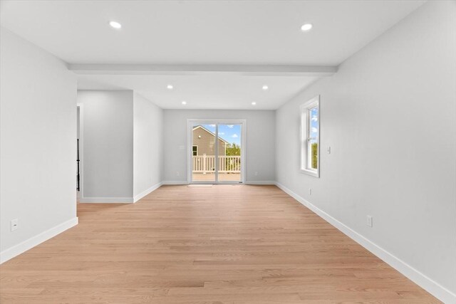 spare room with recessed lighting, baseboards, and light wood-style floors