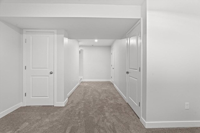basement with carpet, baseboards, and recessed lighting