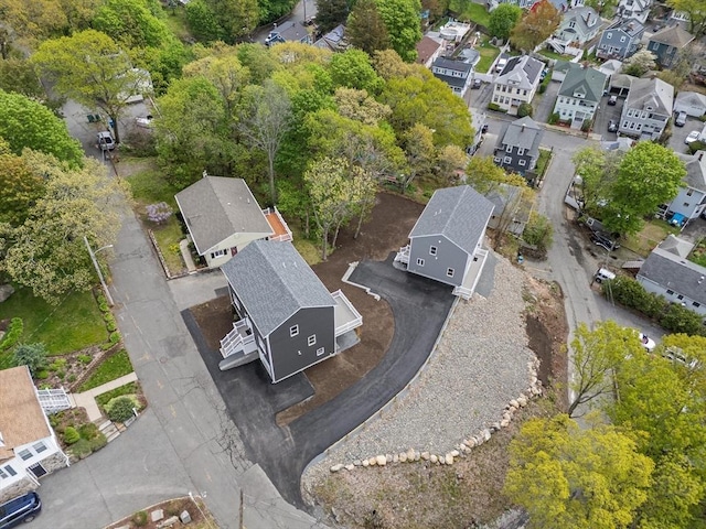 aerial view of property's location with nearby suburban area