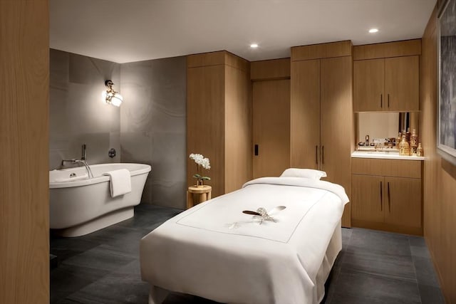 bathroom with vanity and a bathing tub