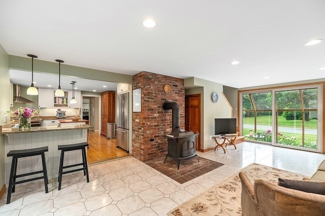 5 Whipple Rd, Hamilton, MA 01982 - living room with a wood stove and recessed lighting