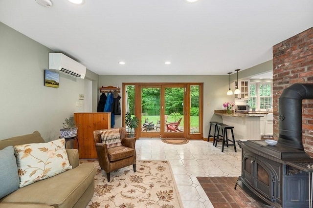 5 Whipple Rd, Hamilton, MA 01982 - living room with a wood stove, plenty of natural light, a wall mounted AC, and recessed lighting