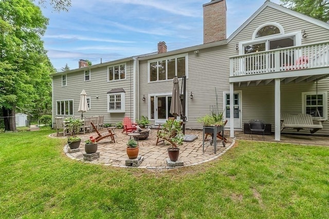 5 Whipple Rd, Hamilton, MA 01982 - rear view of property with a chimney, a yard, a patio, and a wooden deck