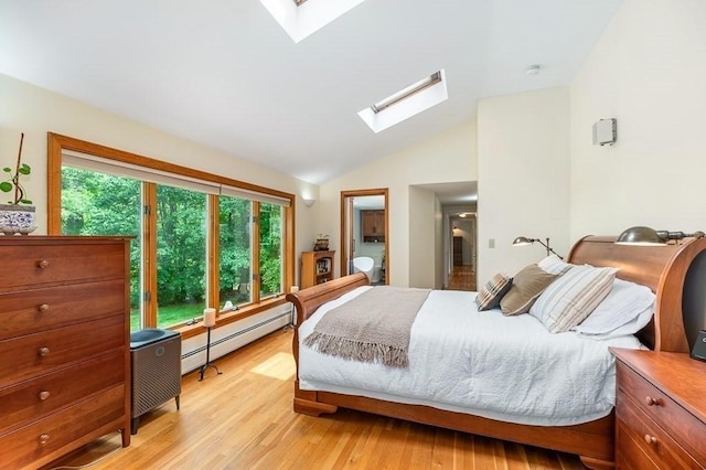 5 Whipple Rd, Hamilton, MA 01982 - bedroom with a skylight, a baseboard radiator, vaulted ceiling, and light wood-style floors