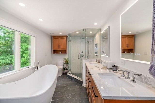 5 Whipple Rd, Hamilton, MA 01982 - bathroom with marble tiled floors, double vanity, a shower stall, a soaking tub, and recessed lighting