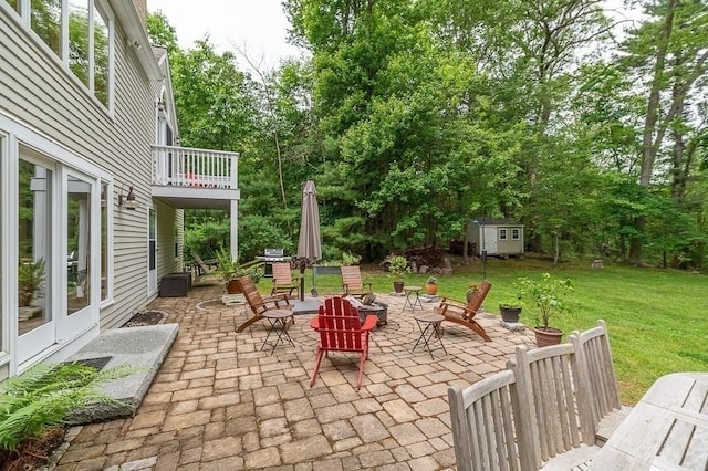 5 Whipple Rd, Hamilton, MA 01982 - patio / terrace with a patio, a storage unit, a lawn, an outdoor fire pit, and view of wooded area