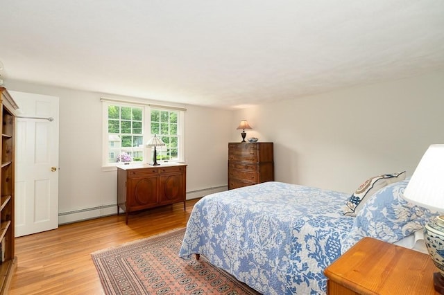 5 Whipple Rd, Hamilton, MA 01982 - bedroom with a baseboard heating unit, light wood-type flooring, and a baseboard radiator