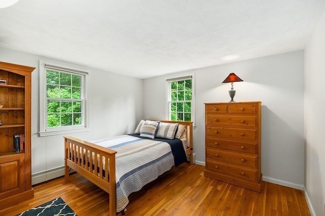 5 Whipple Rd, Hamilton, MA 01982 - bedroom with wood finished floors and a baseboard radiator