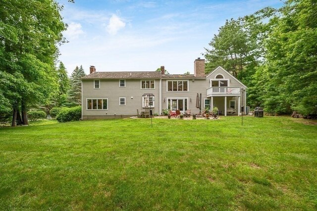5 Whipple Rd, Hamilton, MA 01982 - rear view of property featuring a lawn, a chimney, and a patio area