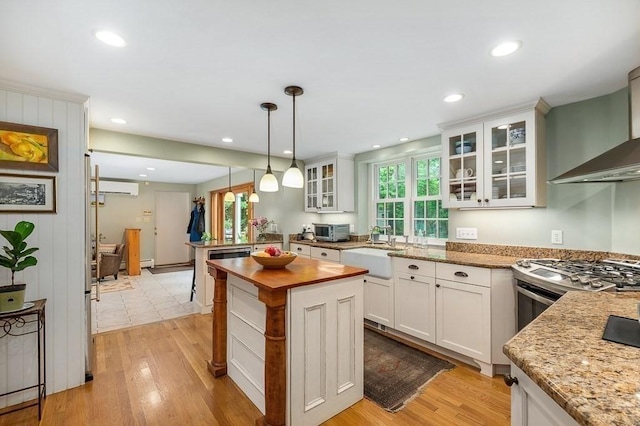 5 Whipple Rd, Hamilton, MA 01982 - kitchen with butcher block countertops, healthy amount of natural light, decorative light fixtures, white cabinetry, and recessed lighting