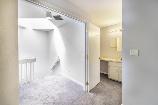 73 Mountain Gate Rd Unit 73, Ashland, MA 01721 - corridor with carpet, a sink, an upstairs landing, and baseboards