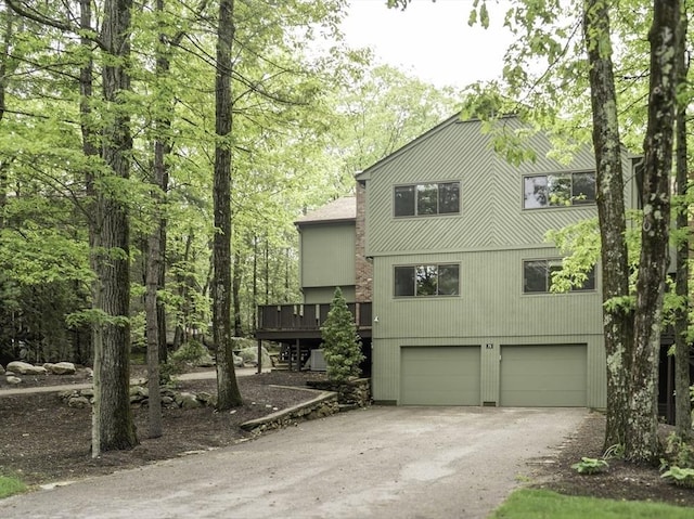 73 Mountain Gate Rd Unit 73, Ashland, MA 01721 - view of front of property featuring an attached garage, asphalt driveway, and a wooden deck