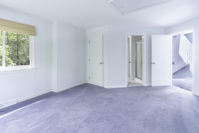 73 Mountain Gate Rd Unit 73, Ashland, MA 01721 - unfurnished bedroom with carpet flooring, attic access, and baseboards