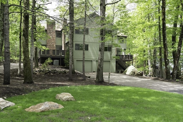73 Mountain Gate Rd Unit 73, Ashland, MA 01721 - back of house with concrete driveway, stairway, and a yard