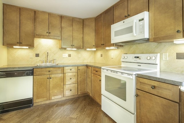 73 Mountain Gate Rd Unit 73, Ashland, MA 01721 - kitchen with white appliances, wood finished floors, a sink, backsplash, and light countertops