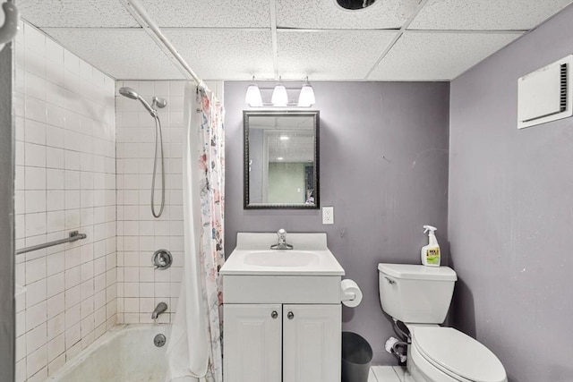 full bathroom featuring shower / bath combo, a paneled ceiling, toilet, and vanity