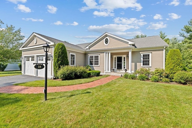 28 Ridgewood Xing Unit 28, Hingham, MA 02043 - view of front of house featuring asphalt driveway, a garage, a front yard, and covered porch