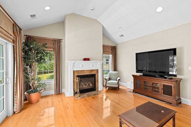 28 Ridgewood Xing Unit 28, Hingham, MA 02043 - living area featuring vaulted ceiling, light wood-type flooring, a premium fireplace, plenty of natural light, and recessed lighting