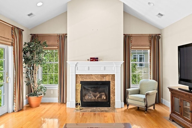 28 Ridgewood Xing Unit 28, Hingham, MA 02043 - living area featuring lofted ceiling, a fireplace, wood finished floors, plenty of natural light, and recessed lighting