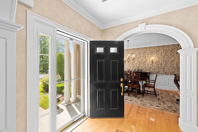 28 Ridgewood Xing Unit 28, Hingham, MA 02043 - entryway featuring decorative columns, wood finished floors, ornamental molding, arched walkways, and wallpapered walls