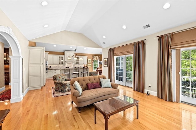 28 Ridgewood Xing Unit 28, Hingham, MA 02043 - living room featuring light wood finished floors, plenty of natural light, lofted ceiling, arched walkways, and recessed lighting