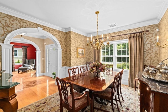 28 Ridgewood Xing Unit 28, Hingham, MA 02043 - dining room with wallpapered walls, a chandelier, arched walkways, decorative columns, and ornamental molding