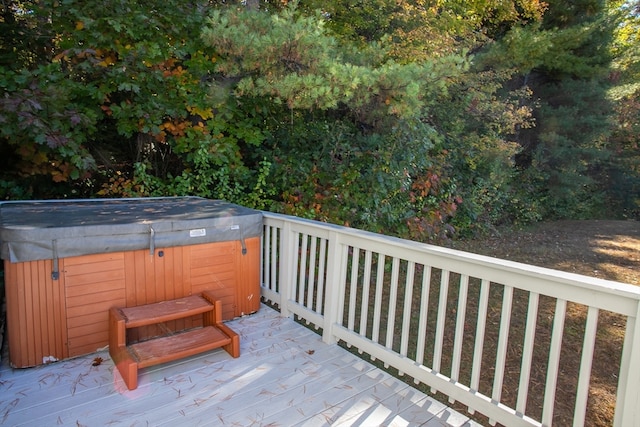 wooden terrace with a hot tub