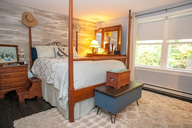 carpeted bedroom featuring baseboard heating