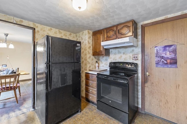 43 Pleasantview St, Ludlow, MA 01056 - kitchen featuring black appliances, under cabinet range hood, wallpapered walls, brown cabinetry, and baseboards