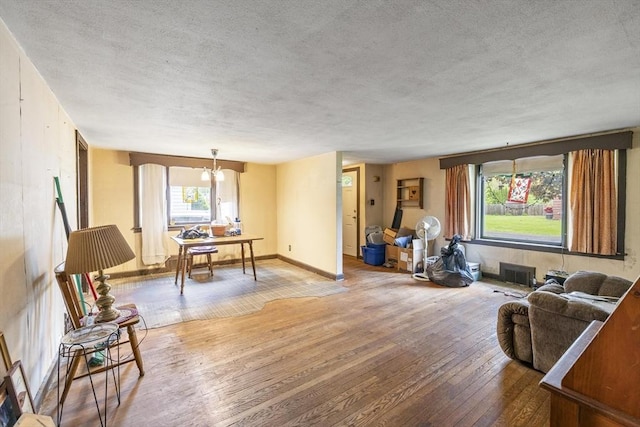 43 Pleasantview St, Ludlow, MA 01056 - living area with a textured ceiling, wood-type flooring, baseboards, and an office area