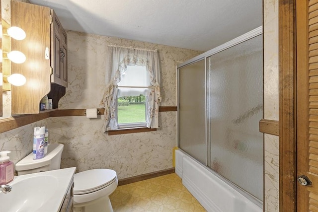 43 Pleasantview St, Ludlow, MA 01056 - full bath with wallpapered walls, toilet, vanity, tile patterned floors, and shower / bath combination with glass door