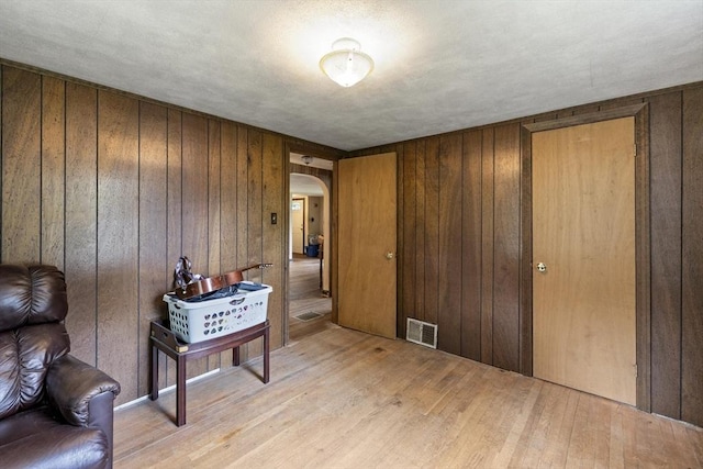 43 Pleasantview St, Ludlow, MA 01056 - foyer featuring arched walkways, light wood-type flooring, and wooden walls