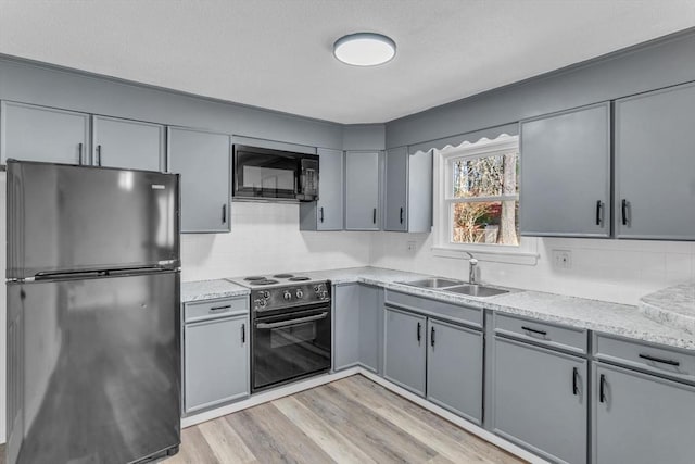 49 Wimbleton Dr, Longmeadow, MA 01106 - kitchen featuring black appliances, a sink, and gray cabinetry