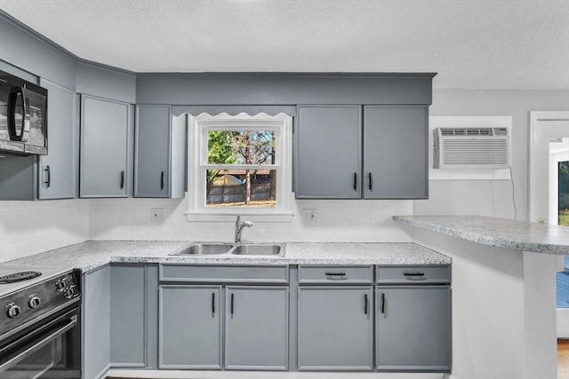 49 Wimbleton Dr, Longmeadow, MA 01106 - kitchen featuring black appliances, a sink, a wall unit AC, gray cabinetry, and a textured ceiling