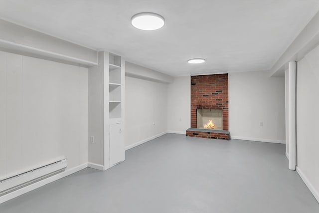 unfurnished living room featuring concrete flooring, a baseboard heating unit, and a fireplace