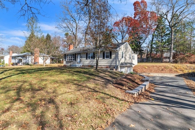 49 Wimbleton Dr, Longmeadow, MA 01106 - single story home with driveway, a front lawn, a chimney, and an attached garage