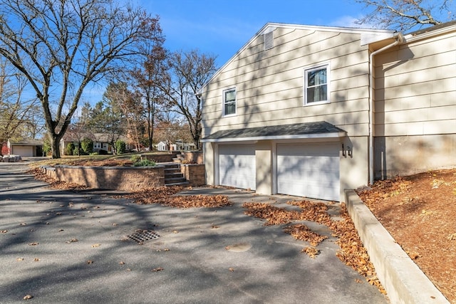 view of home's exterior featuring a garage