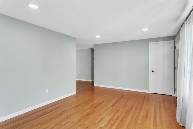 spare room with light hardwood / wood-style floors