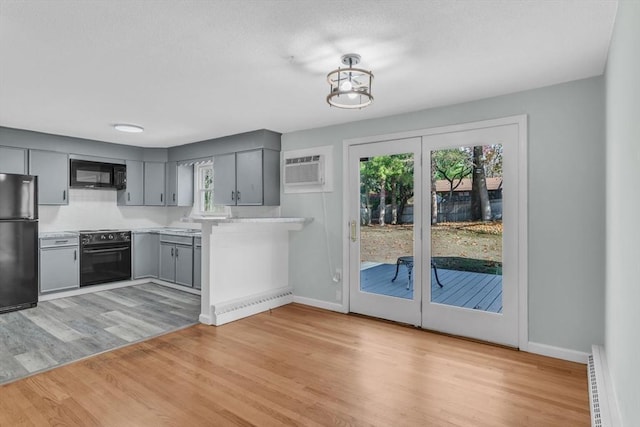 49 Wimbleton Dr, Longmeadow, MA 01106 - kitchen with black appliances, gray cabinets, light countertops, and healthy amount of natural light