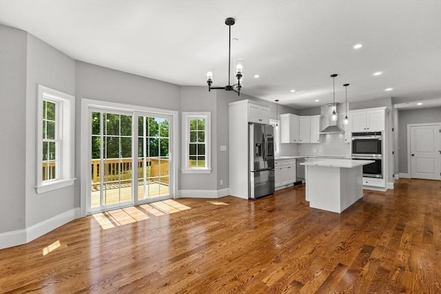 LOT11R 46 Loidie Ln, Brockton, MA 02301 - kitchen with stainless steel appliances, wall chimney exhaust hood, light countertops, decorative backsplash, and recessed lighting