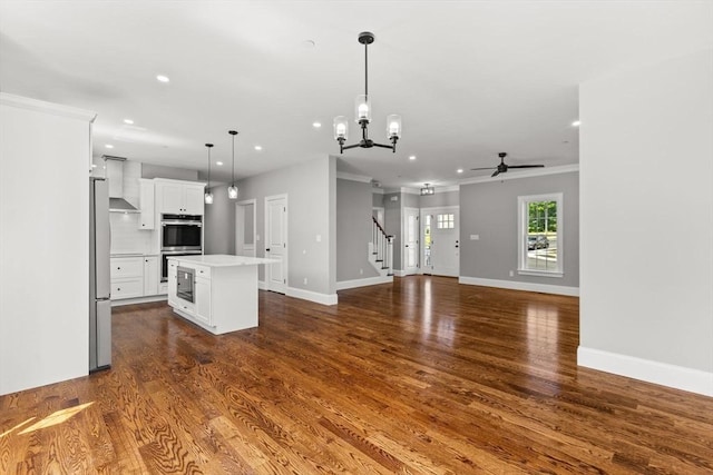 LOT11R 46 Loidie Ln, Brockton, MA 02301 - unfurnished living room with stairs, recessed lighting, a ceiling fan, dark wood-type flooring, and a chandelier