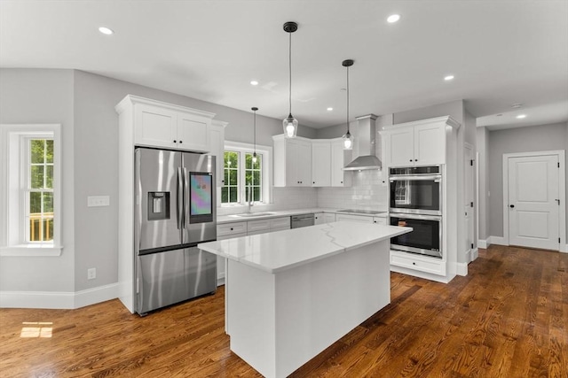 LOT11R 46 Loidie Ln, Brockton, MA 02301 - kitchen with stainless steel appliances, wall chimney range hood, decorative backsplash, dark wood-type flooring, and a center island