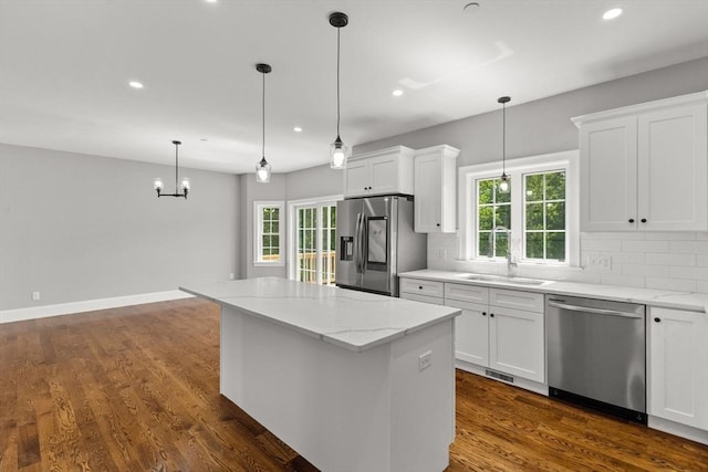 LOT11R 46 Loidie Ln, Brockton, MA 02301 - kitchen with appliances with stainless steel finishes, backsplash, recessed lighting, a kitchen island, and white cabinets