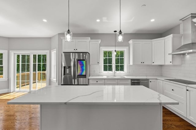 LOT11R 46 Loidie Ln, Brockton, MA 02301 - kitchen with appliances with stainless steel finishes, wall chimney range hood, white cabinets, tasteful backsplash, and recessed lighting