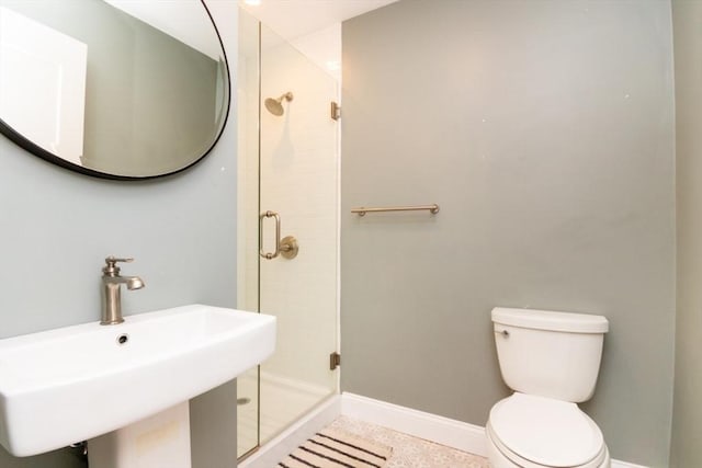 bathroom with sink, tile patterned flooring, an enclosed shower, and toilet